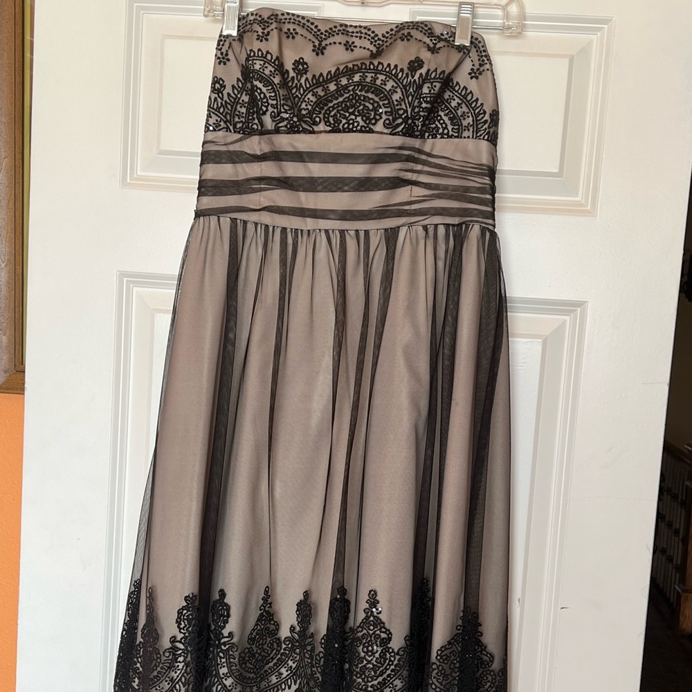 Beautiful David’s Bridal knee length dress.
